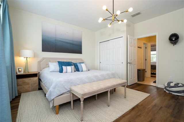 13235 Vennetta Way, Windermere, FL 34786 - bedroom with a chandelier, dark wood-style flooring, and a closet