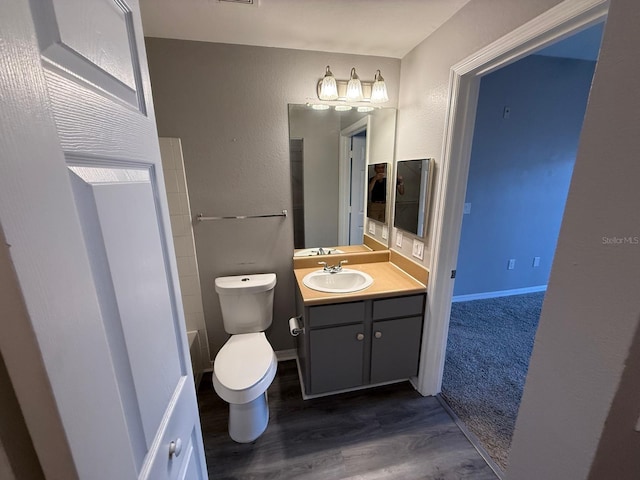 2015 Erving Cir Unit 307, Ocoee, FL 34761 - bathroom featuring vanity and wood finished floors