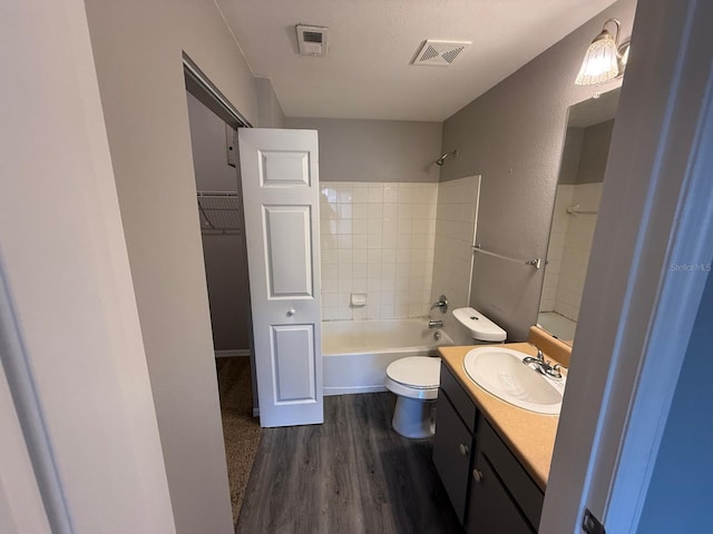 2015 Erving Cir Unit 307, Ocoee, FL 34761 - full bath with vanity, wood finished floors, and shower / bath combination