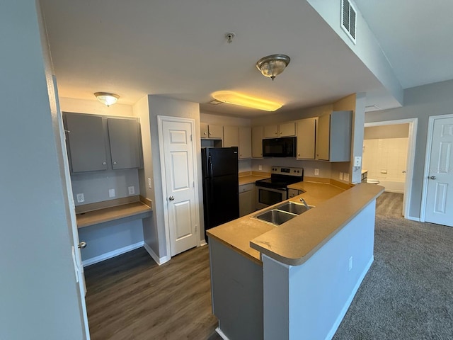 2015 Erving Cir Unit 307, Ocoee, FL 34761 - kitchen featuring black appliances, a peninsula, light countertops, and gray cabinetry