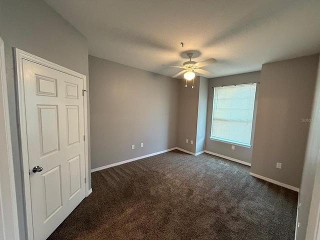 2015 Erving Cir Unit 307, Ocoee, FL 34761 - empty room featuring ceiling fan and dark carpet