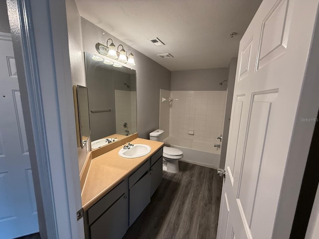2015 Erving Cir Unit 307, Ocoee, FL 34761 - full bathroom with vanity, wood finished floors, and shower / tub combination