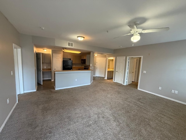 2015 Erving Cir Unit 307, Ocoee, FL 34761 - unfurnished living room with dark colored carpet and a ceiling fan