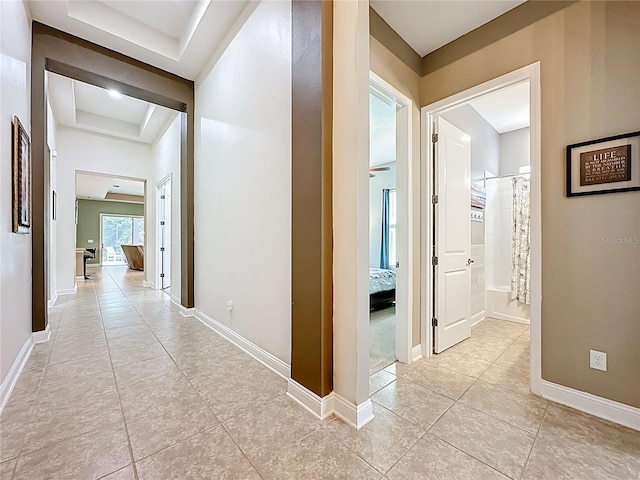 297 Shadow Ridge Trl, Ponte Vedra, FL 32081 - corridor with a tray ceiling and light tile patterned floors