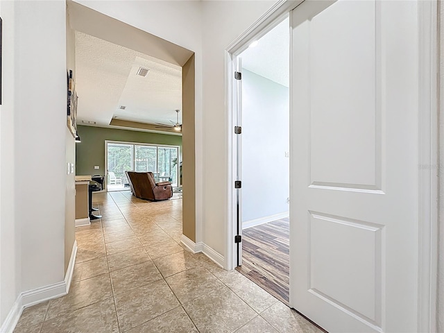 297 Shadow Ridge Trl, Ponte Vedra, FL 32081 - hallway with light tile patterned flooring and a textured ceiling