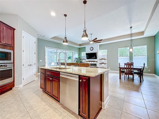 297 Shadow Ridge Trl, Ponte Vedra, FL 32081 - kitchen with stainless steel appliances, a tray ceiling, dark brown cabinets, a textured ceiling, and recessed lighting
