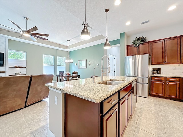 297 Shadow Ridge Trl, Ponte Vedra, FL 32081 - kitchen featuring freestanding refrigerator, light tile patterned flooring, a ceiling fan, tasteful backsplash, and decorative light fixtures