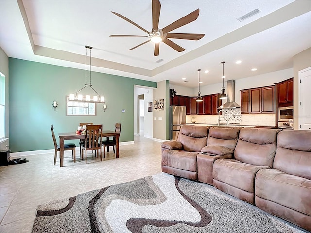 297 Shadow Ridge Trl, Ponte Vedra, FL 32081 - living room with ceiling fan, a tray ceiling, a chandelier, light tile patterned floors, and recessed lighting