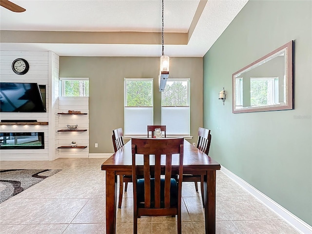 297 Shadow Ridge Trl, Ponte Vedra, FL 32081 - tiled dining space featuring baseboards and a fireplace