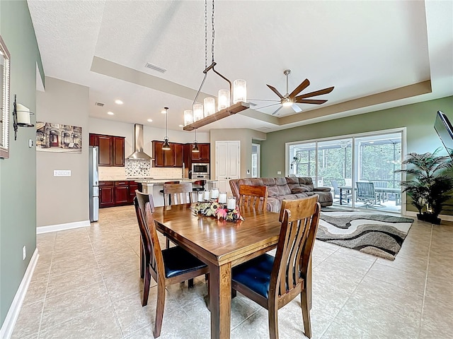 297 Shadow Ridge Trl, Ponte Vedra, FL 32081 - dining room with ceiling fan, a raised ceiling, light tile patterned floors, and recessed lighting
