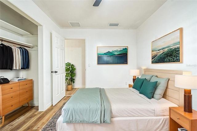 201 E 7th St, Chuluota, FL 32766 - bedroom with light wood finished floors and ceiling fan