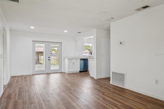 201 E 7th St, Chuluota, FL 32766 - unfurnished living room featuring wood finished floors, french doors, and recessed lighting