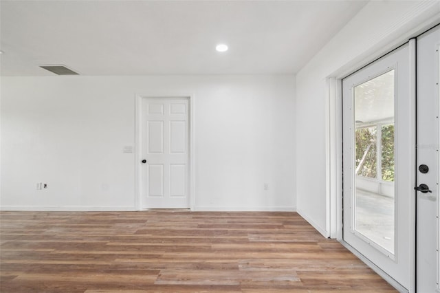 201 E 7th St, Chuluota, FL 32766 - unfurnished room with light wood finished floors and recessed lighting