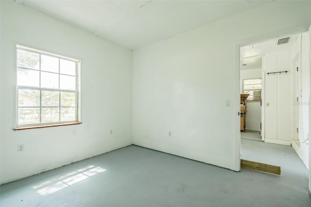 201 E 7th St, Chuluota, FL 32766 - spare room with concrete floors