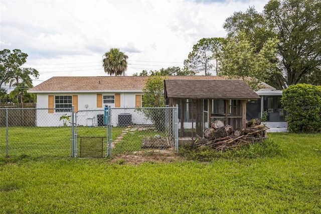 201 E 7th St, Chuluota, FL 32766 - rear view of property with a gate and stucco siding