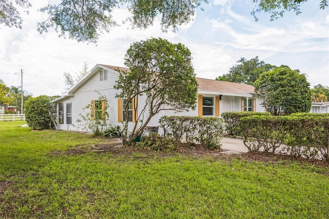 201 E 7th St, Chuluota, FL 32766 - view of home's exterior with stucco siding