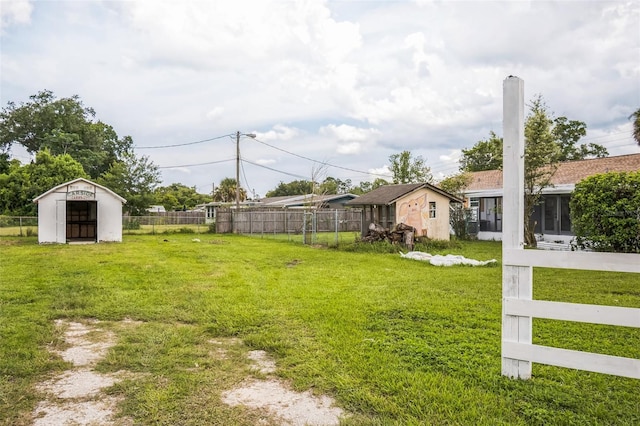 201 E 7th St, Chuluota, FL 32766 - view of yard with a shed and a sunroom