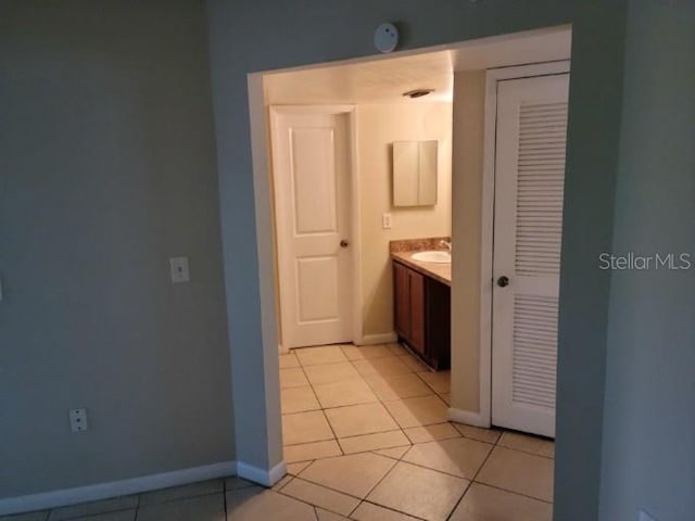 4322 Lakeway Dr Unit 13F, Orlando, FL 32839 - bathroom with tile patterned floors, vanity, and a closet