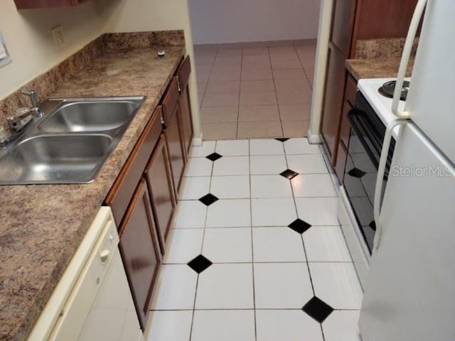 4322 Lakeway Dr Unit 13F, Orlando, FL 32839 - kitchen featuring dishwasher, light tile patterned flooring, stove, and brown cabinets