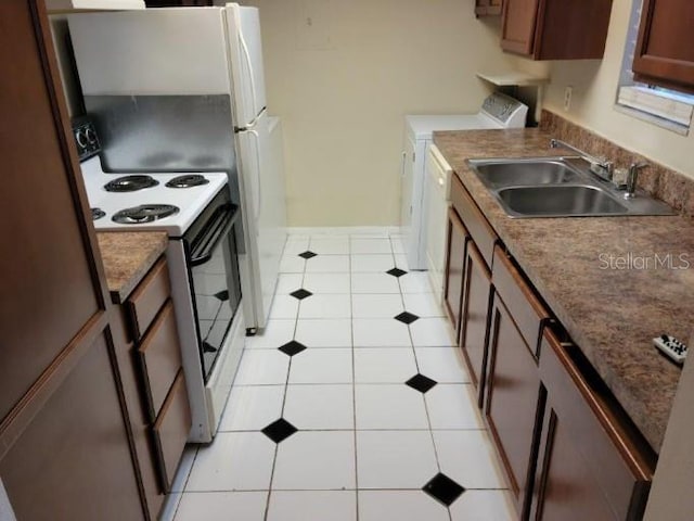 4322 Lakeway Dr Unit 13F, Orlando, FL 32839 - kitchen featuring white electric stove, light tile patterned floors, and separate washer and dryer