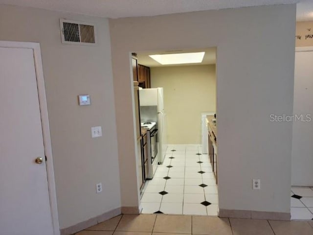 4322 Lakeway Dr Unit 13F, Orlando, FL 32839 - kitchen with light tile patterned floors and electric stove