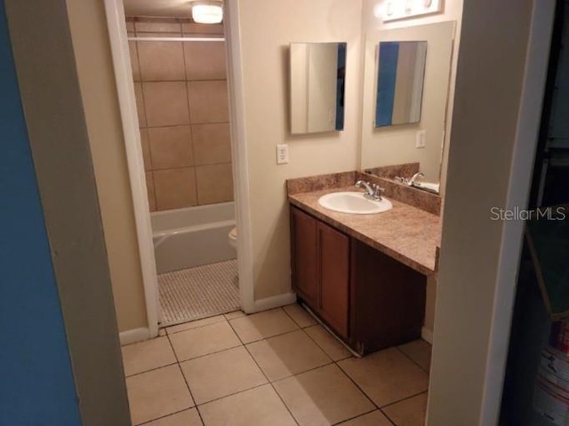 4322 Lakeway Dr Unit 13F, Orlando, FL 32839 - full bathroom with vanity, tile patterned floors, and washtub / shower combination