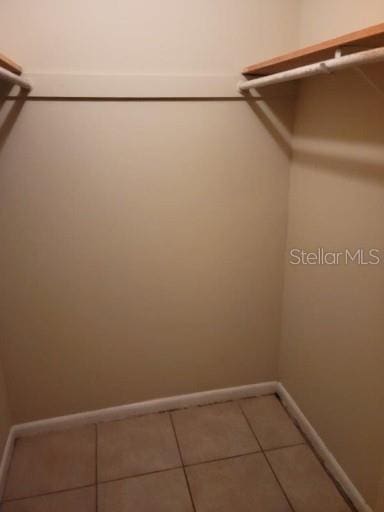 4322 Lakeway Dr Unit 13F, Orlando, FL 32839 - spacious closet featuring light tile patterned floors