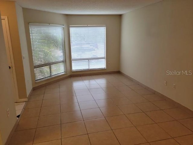4322 Lakeway Dr Unit 13F, Orlando, FL 32839 - unfurnished room featuring light tile patterned floors and baseboards