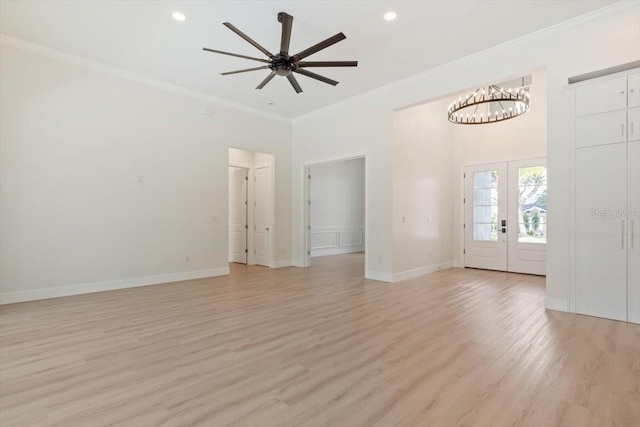 17 Old Oak Dr N, Palm Coast, FL 32137 - unfurnished living room with light wood-type flooring, crown molding, a chandelier, a ceiling fan, and recessed lighting