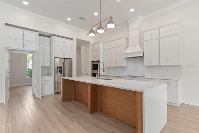 17 Old Oak Dr N, Palm Coast, FL 32137 - kitchen with high end fridge, ornamental molding, black electric cooktop, a large island, and light wood-style flooring