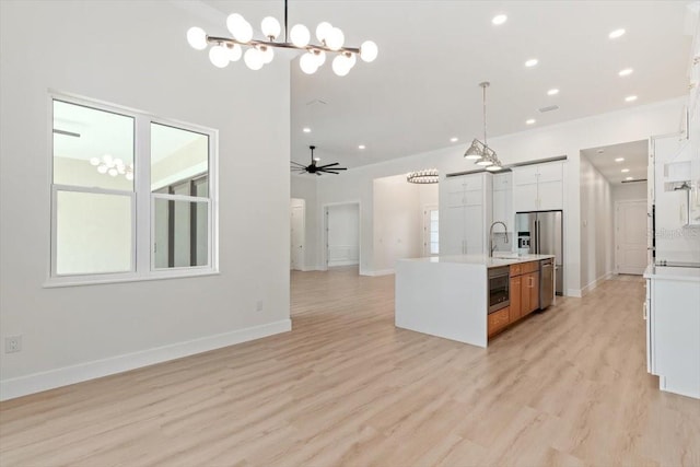 17 Old Oak Dr N, Palm Coast, FL 32137 - kitchen featuring appliances with stainless steel finishes, light countertops, open floor plan, white cabinets, and recessed lighting