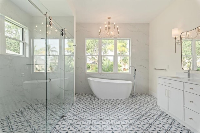 17 Old Oak Dr N, Palm Coast, FL 32137 - full bath with a chandelier, a freestanding bath, vanity, a marble finish shower, and tile patterned floors