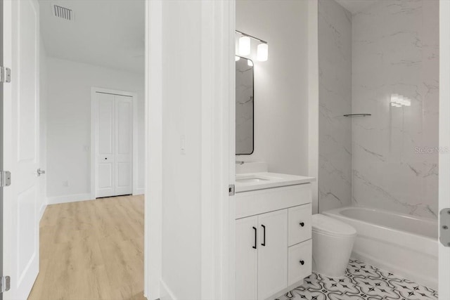 17 Old Oak Dr N, Palm Coast, FL 32137 - bathroom featuring vanity, shower / bathtub combination, and wood finished floors