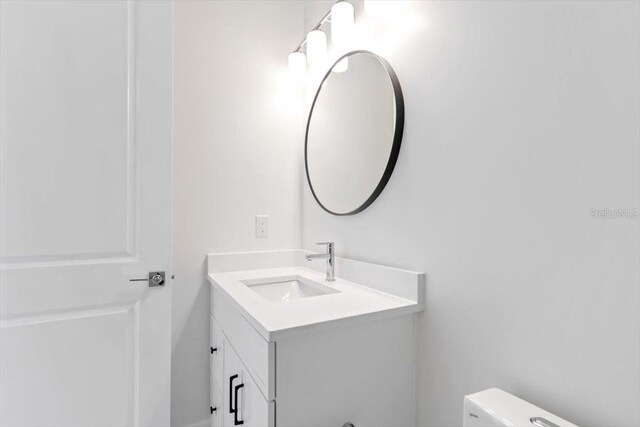 17 Old Oak Dr N, Palm Coast, FL 32137 - bathroom with vanity and toilet