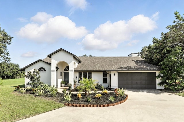 960 Falls Trl, Malabar, FL 32950 - ranch-style home featuring concrete driveway, an attached garage, a front lawn, stucco siding, and a chimney