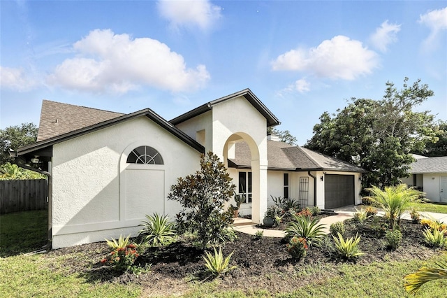 960 Falls Trl, Malabar, FL 32950 - view of front of property featuring an attached garage, stucco siding, driveway, and a shingled roof
