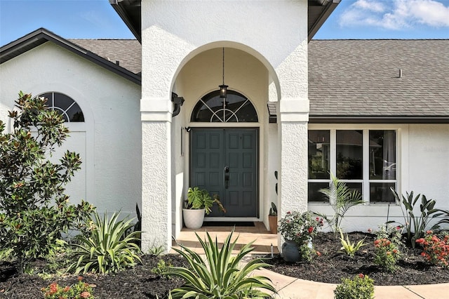 960 Falls Trl, Malabar, FL 32950 - entrance to property with a shingled roof and stucco siding