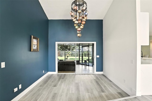 960 Falls Trl, Malabar, FL 32950 - unfurnished dining area featuring a chandelier and wood finished floors