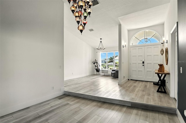 960 Falls Trl, Malabar, FL 32950 - entrance foyer featuring a chandelier and wood finished floors