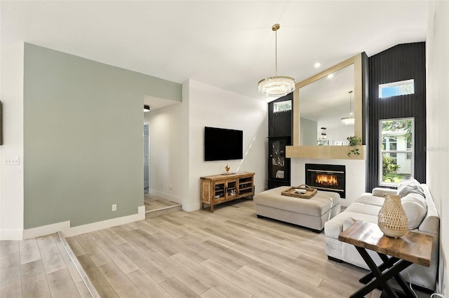 960 Falls Trl, Malabar, FL 32950 - living area featuring light wood-style floors, a large fireplace, recessed lighting, and a chandelier