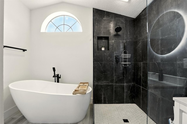 960 Falls Trl, Malabar, FL 32950 - full bath with a freestanding tub, a tile shower, vaulted ceiling, and vanity