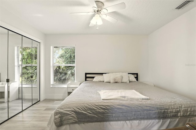 960 Falls Trl, Malabar, FL 32950 - bedroom with light wood-type flooring, ceiling fan, and a closet