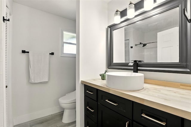 960 Falls Trl, Malabar, FL 32950 - bathroom featuring a closet, vanity, and wood finished floors