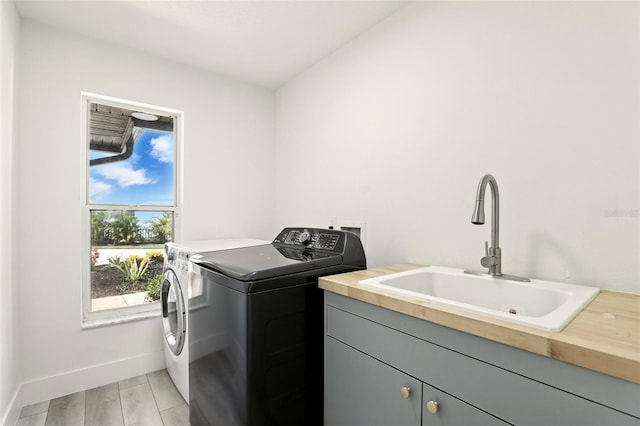 960 Falls Trl, Malabar, FL 32950 - laundry area featuring independent washer and dryer and cabinet space