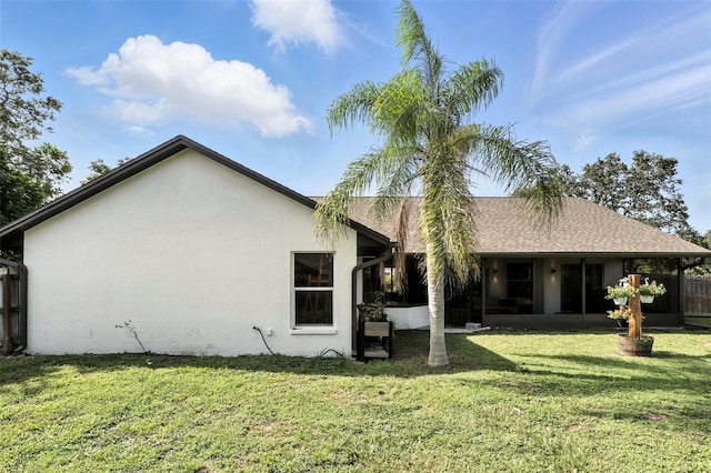 960 Falls Trl, Malabar, FL 32950 - rear view of house featuring a sunroom and stucco siding