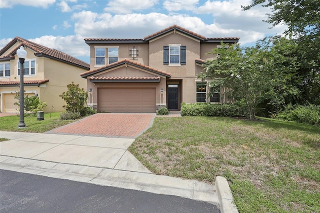 1833 Benoit Ter, Davenport, FL 33837 - mediterranean / spanish-style home with decorative driveway, a tile roof, stucco siding, and a front yard