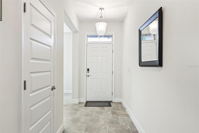 1833 Benoit Ter, Davenport, FL 33837 - entrance foyer with light stone finish flooring and baseboards