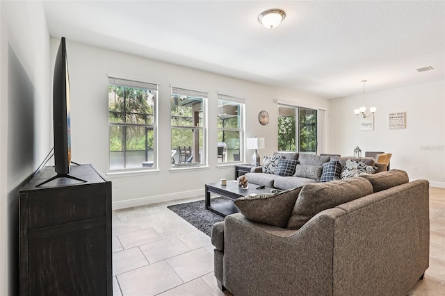 1833 Benoit Ter, Davenport, FL 33837 - living area with a chandelier and light tile patterned flooring