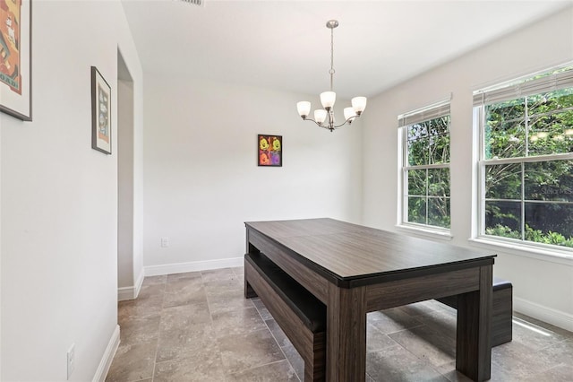 1833 Benoit Ter, Davenport, FL 33837 - dining space with a chandelier and light stone finish floors