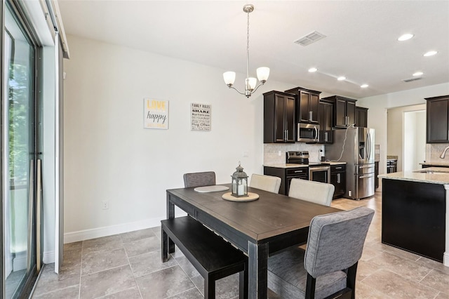 1833 Benoit Ter, Davenport, FL 33837 - dining area featuring a chandelier and recessed lighting